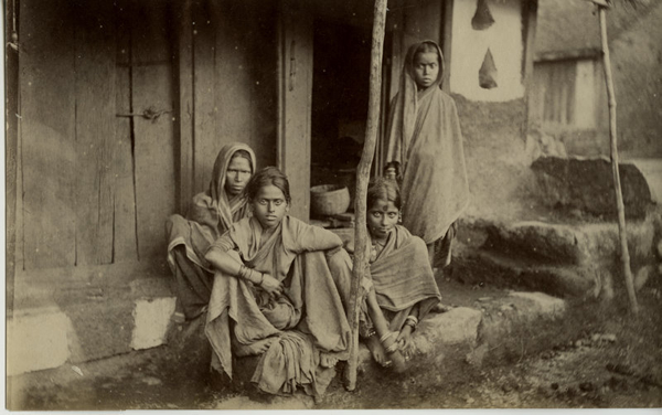 Indian Woman and Girls Outside of a House