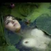 Woman submerged in a pond among lily pads - fine art photographers