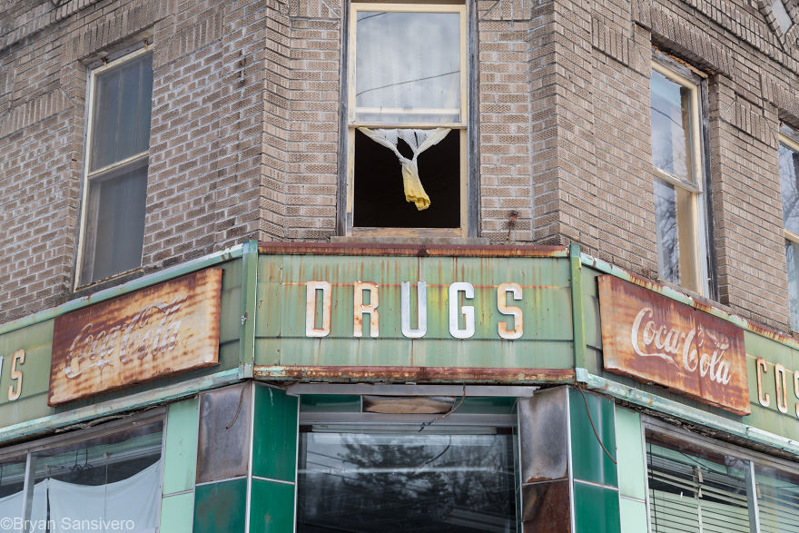 An open windows upstairs by the front door at the store