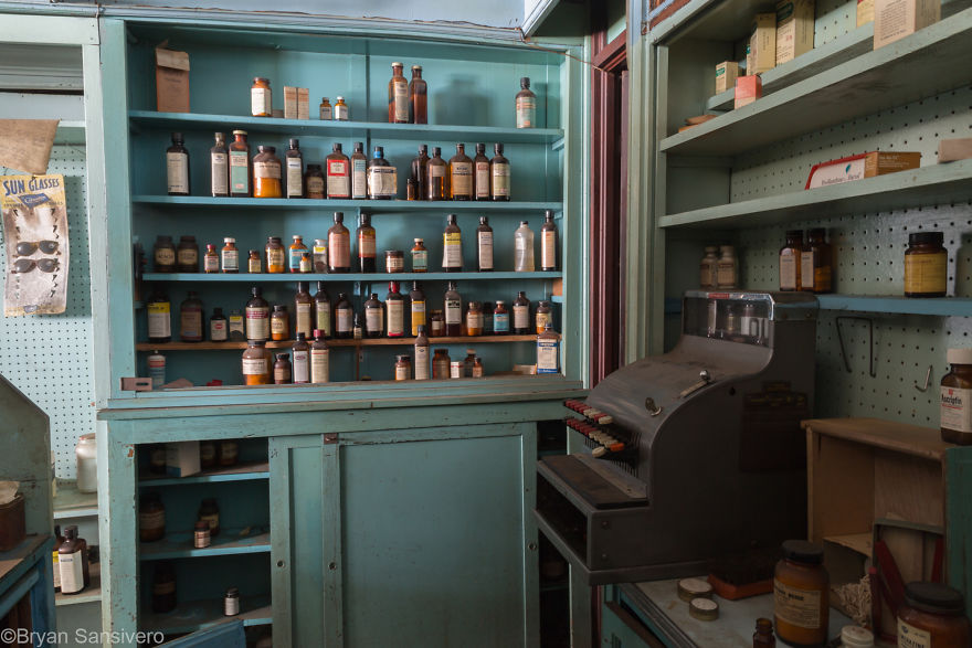 Vintage cash register and medicines sit as if were being used yesterday