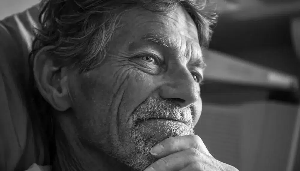 Close-up portrait of a thoughtful older man, black and white photo