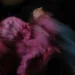 My Personal Best: Fine Art Portrait Photographer Ilaria Facci 13 Woman spinning in a flowing pink dress, motion blur against dark background
