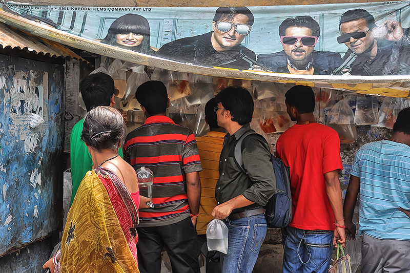 Conversing With The Posters: Street Photography Series By Niladri Adhikary