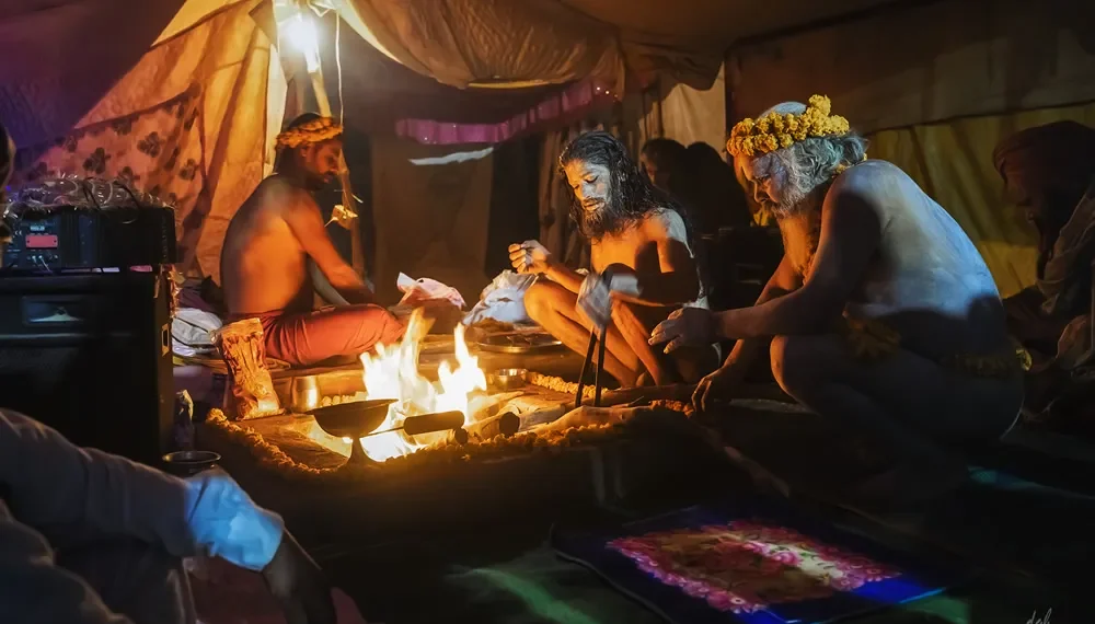 Prayagraj Kumbh Mela 2019: Photo Series By Dashawatar Bade 24 Hindu sadhus performing a sacred fire ritual inside a tent at Kumbh Mela
