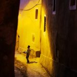 A young boy selling products in the streets of Ouarzazate, Morocco