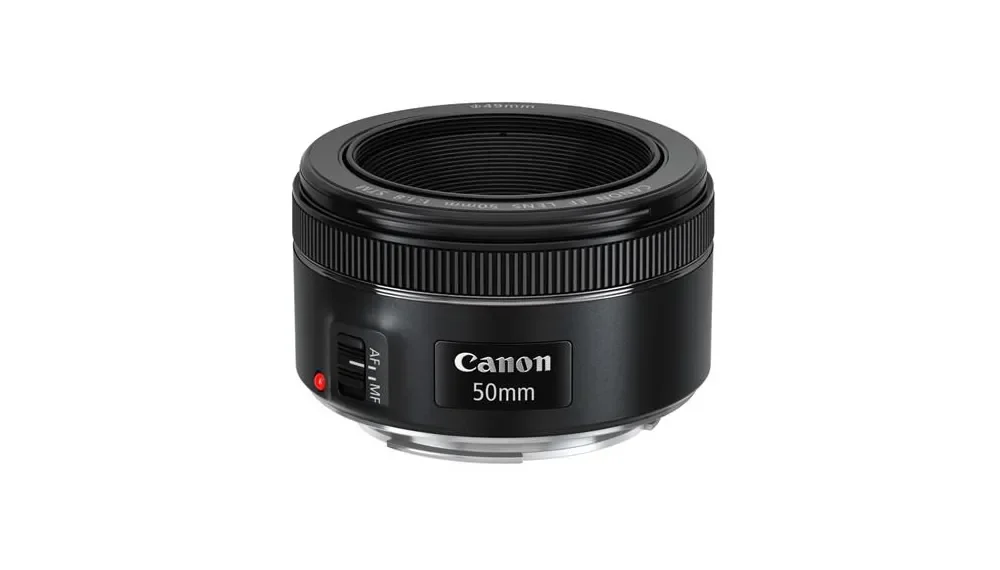 Canon 50mm prime camera lens isolated on white background