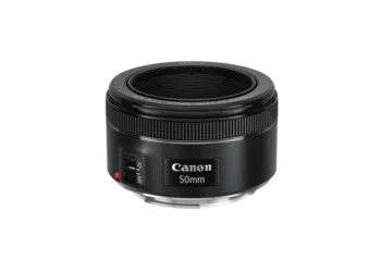 Canon 50mm prime camera lens isolated on white background