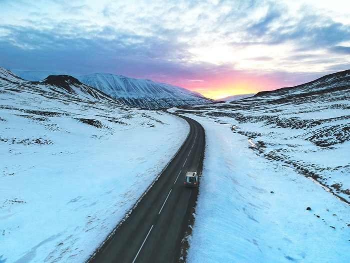 Driving down a lonely road before the sun rises - Iceland