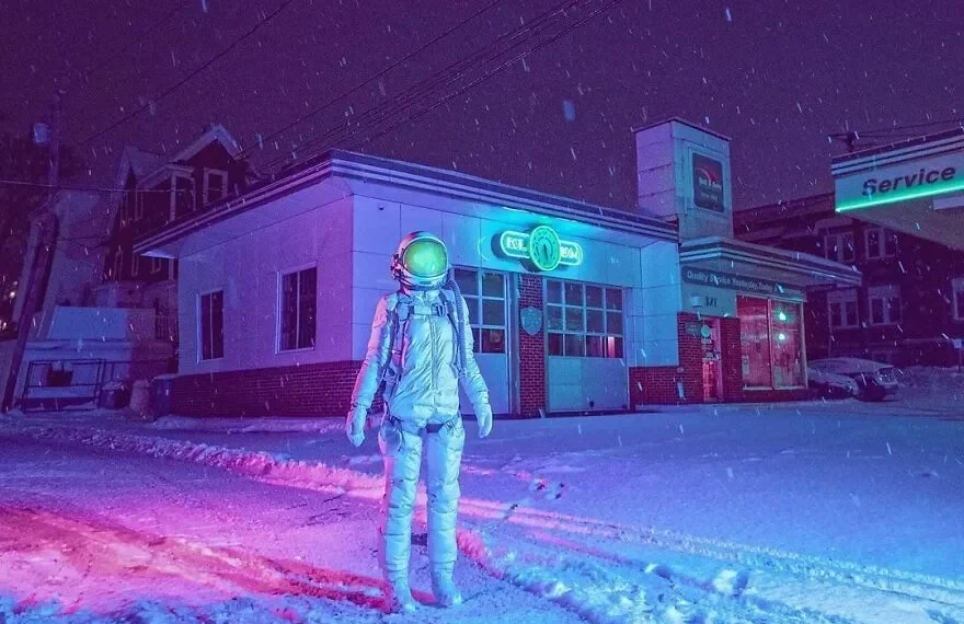 Astronaut standing in snowy street at night under neon purple lights