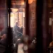 Man sitting alone by a window in a cozy dimly lit interior