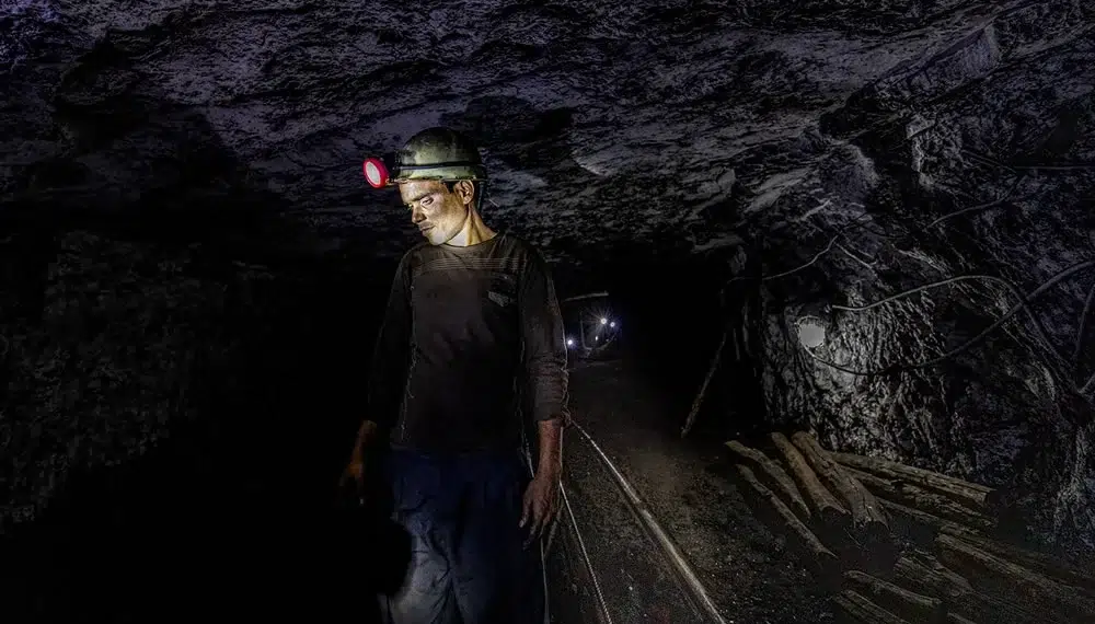 Coal Mine In Phusro, Jharkhand: Photo Series By Sudipta Das 23 Coal miner with headlamp inside a dark underground tunnel in Jharkhand, India