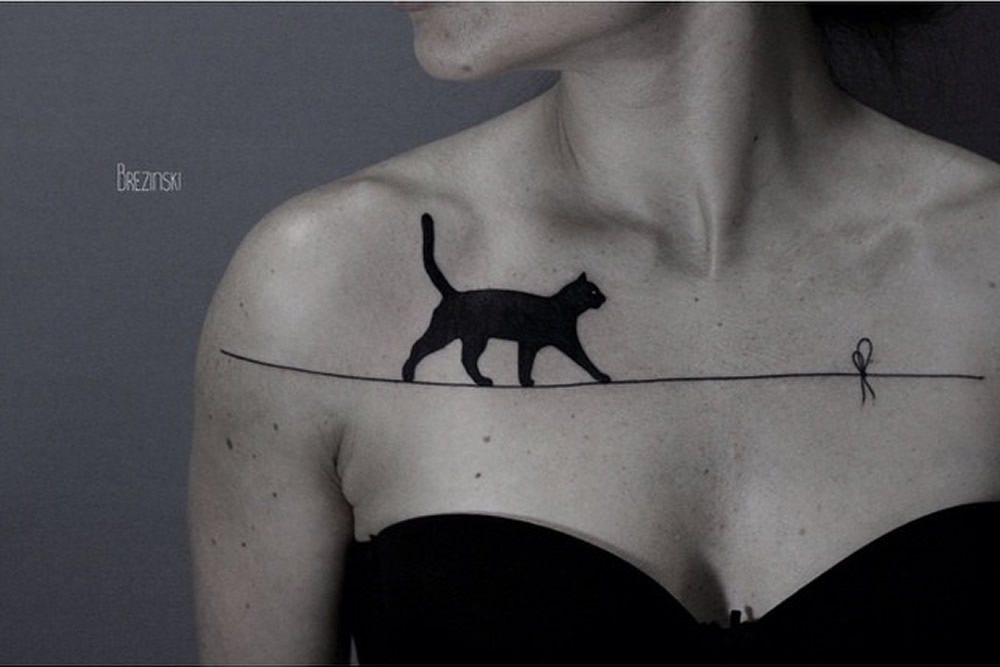 Tattoo Artist Creates Black Ink Tattoo Designs That Flow With The Body’s Curvature