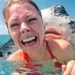 30 Interesting Photos That Whole Story Was Told With A Single Image 71 Woman screaming as a large stingray presses its face against her cheek in the ocean