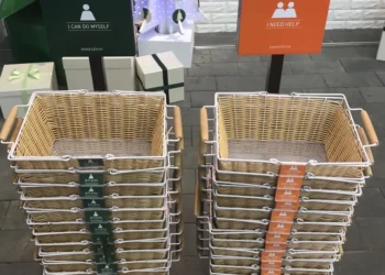 Two shopping basket stacks labeled 'I Can Do Myself' and 'I Need Help' at an Innisfree store