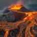 Glowing lava flows streaming down an erupting volcano