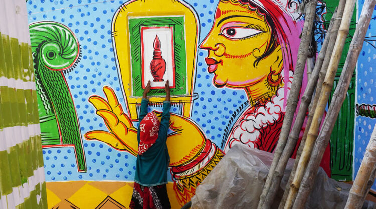 Colorful Wall Art In The Theme Of A Bengali Wedding That Resembles Indian Culture