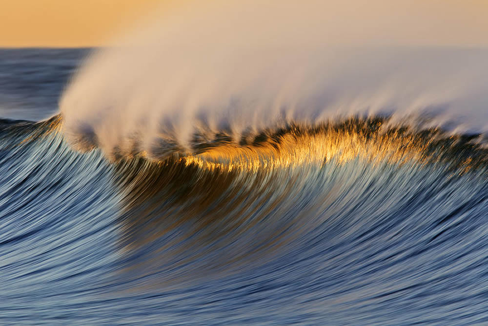 Photographer David Orias Captures Stunning Golden And Iridescent Waves Of The Pacific Ocean