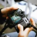 Top Photography Trends to Watch in 2025 51 Hands holding a Fujifilm camera showing the Classic Chrome film simulation menu