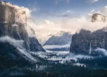 Misty Yosemite Valley with granite cliffs and waterfall, landscape photography