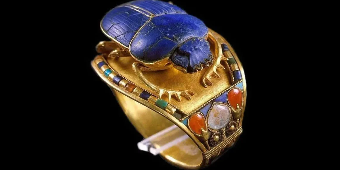 Ancient Egyptian gold scarab ring with lapis lazuli, carnelian, and turquoise inlays
