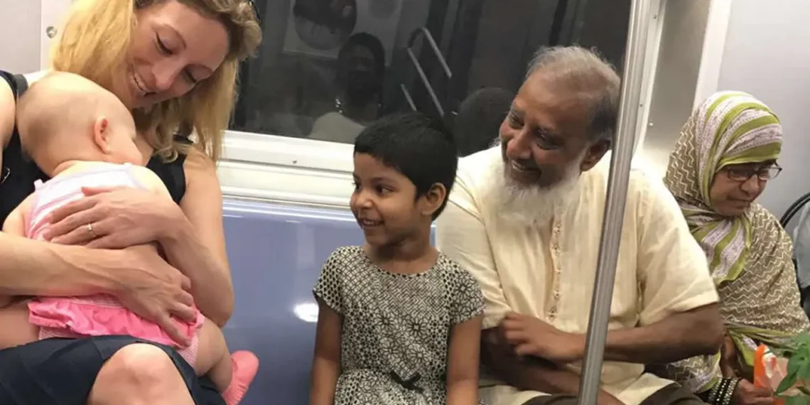 Strangers sharing smiles over a baby on a subway heartwarming street photography