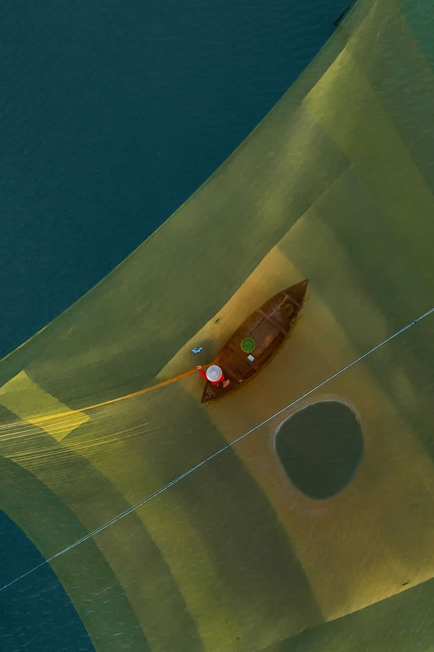 Fishing the Quiet Waters by Prakash Tilokani - Drone Photo Awards 2025 Winners