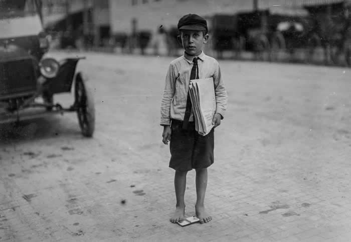 This newsie started every day at 3am and then went to school. Texas, 1913. Photo by Lewis Hine