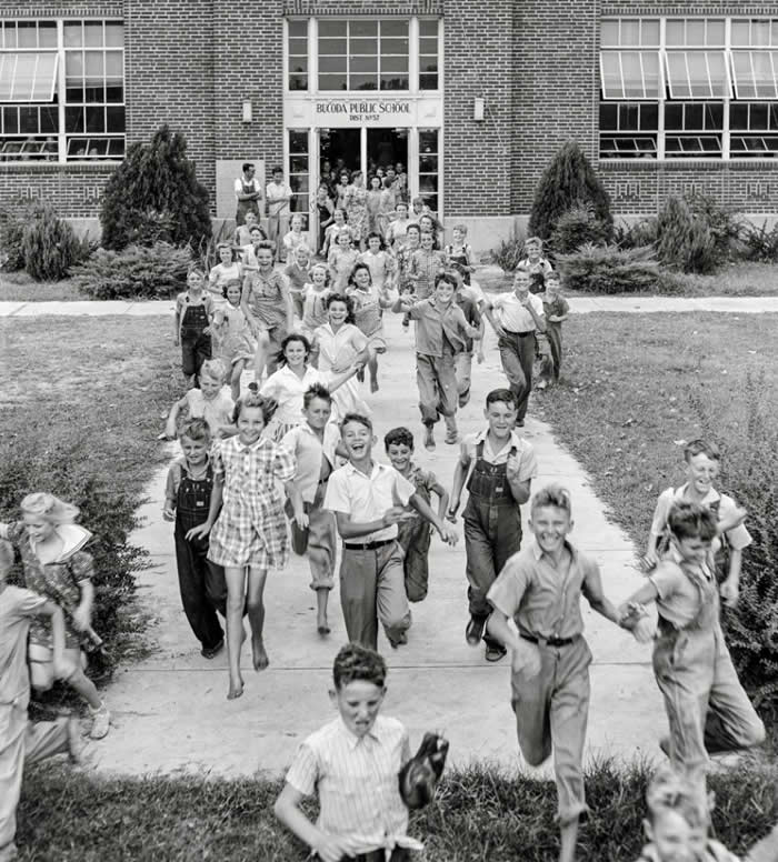 Students happily leaving school, some without shoes in Dunklin County, Missouri, 1942