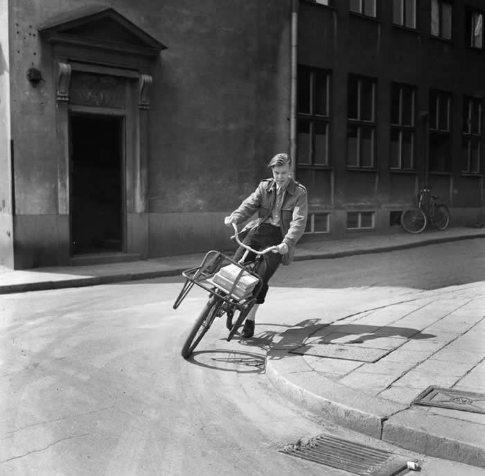 Newspaper delivery boy on his bicycle - Black and White Bicycle Photos of Everyday Life
