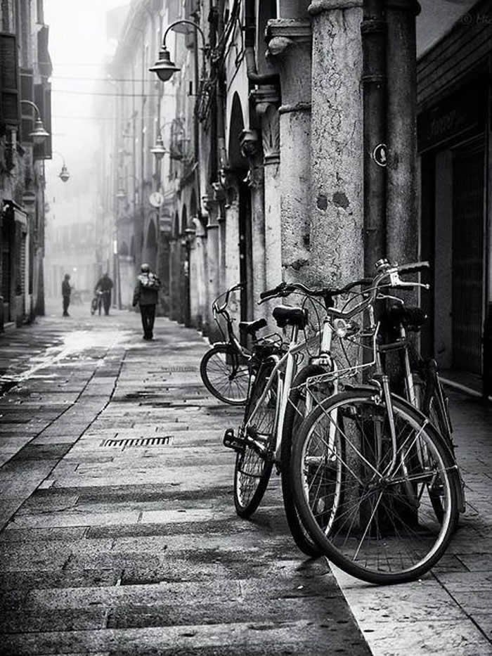Bicycle parked on a quiet street - Black and White Bicycle Photos of Everyday Life
