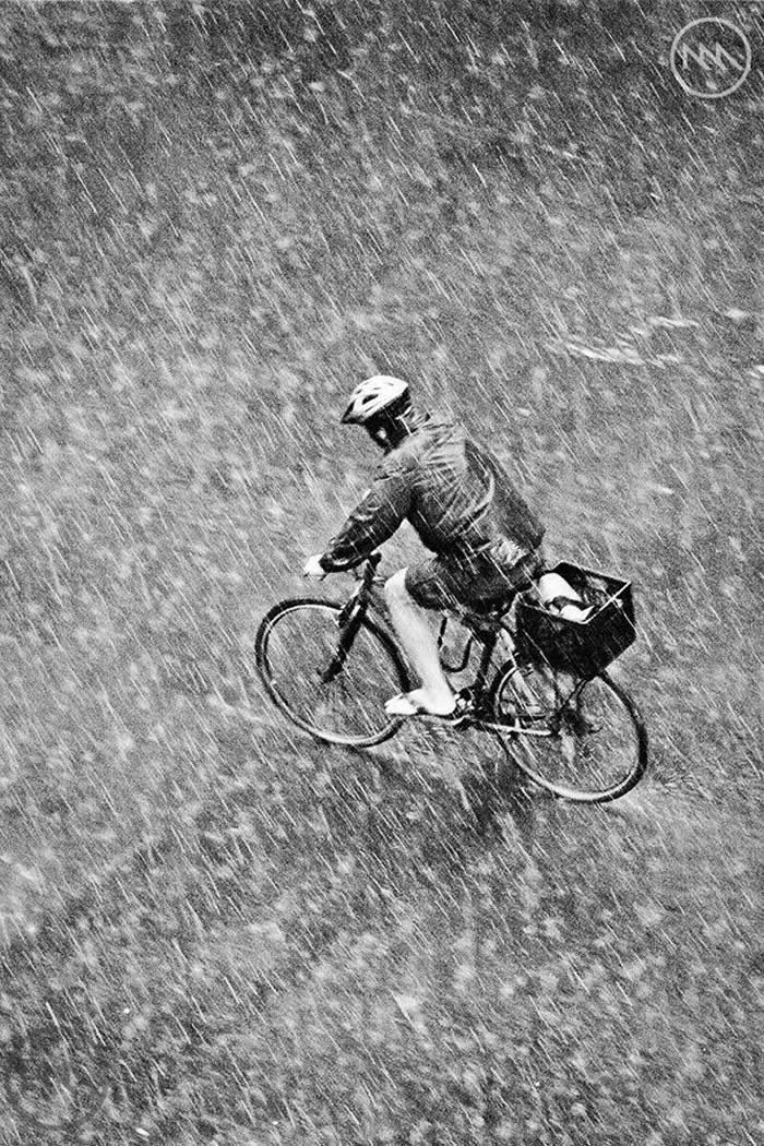 Top-view shot of a bicycle ride in the rain - Black and White Bicycle Photos of Everyday Life