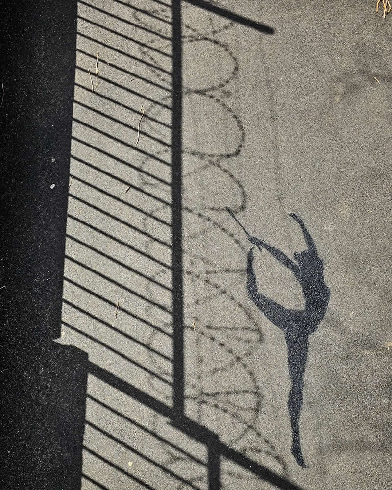 A dancer Shadow combine with wall grills - Funny Creative Street Artworks by Oak Oak