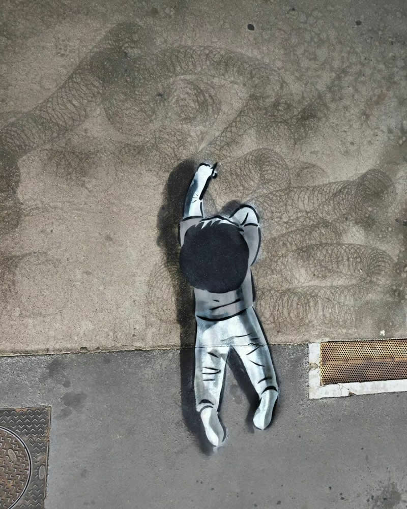 A small boy sketching with pencil - Funny Creative Street Artworks by Oak Oak