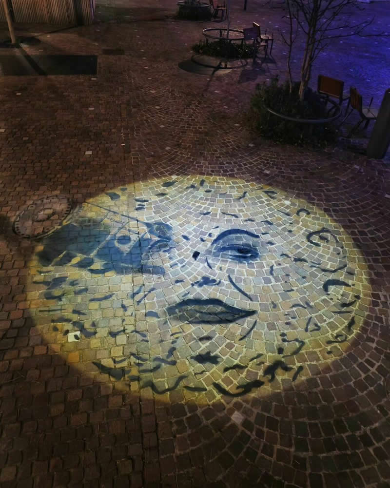 A Face drawing in the round light - Funny Creative Street Artworks by Oak Oak
