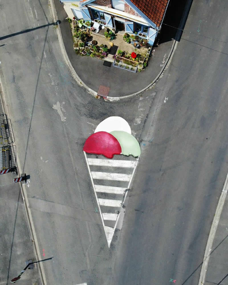 Aerial pathway looks like ice cream cones - Funny Creative Street Artworks by Oak Oak