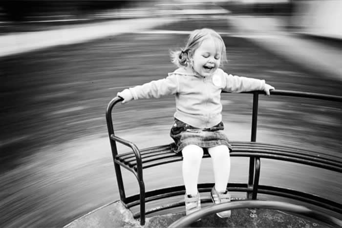 Girl spinning and playing in circles - Pure Joy of Childhood Black and White Photos