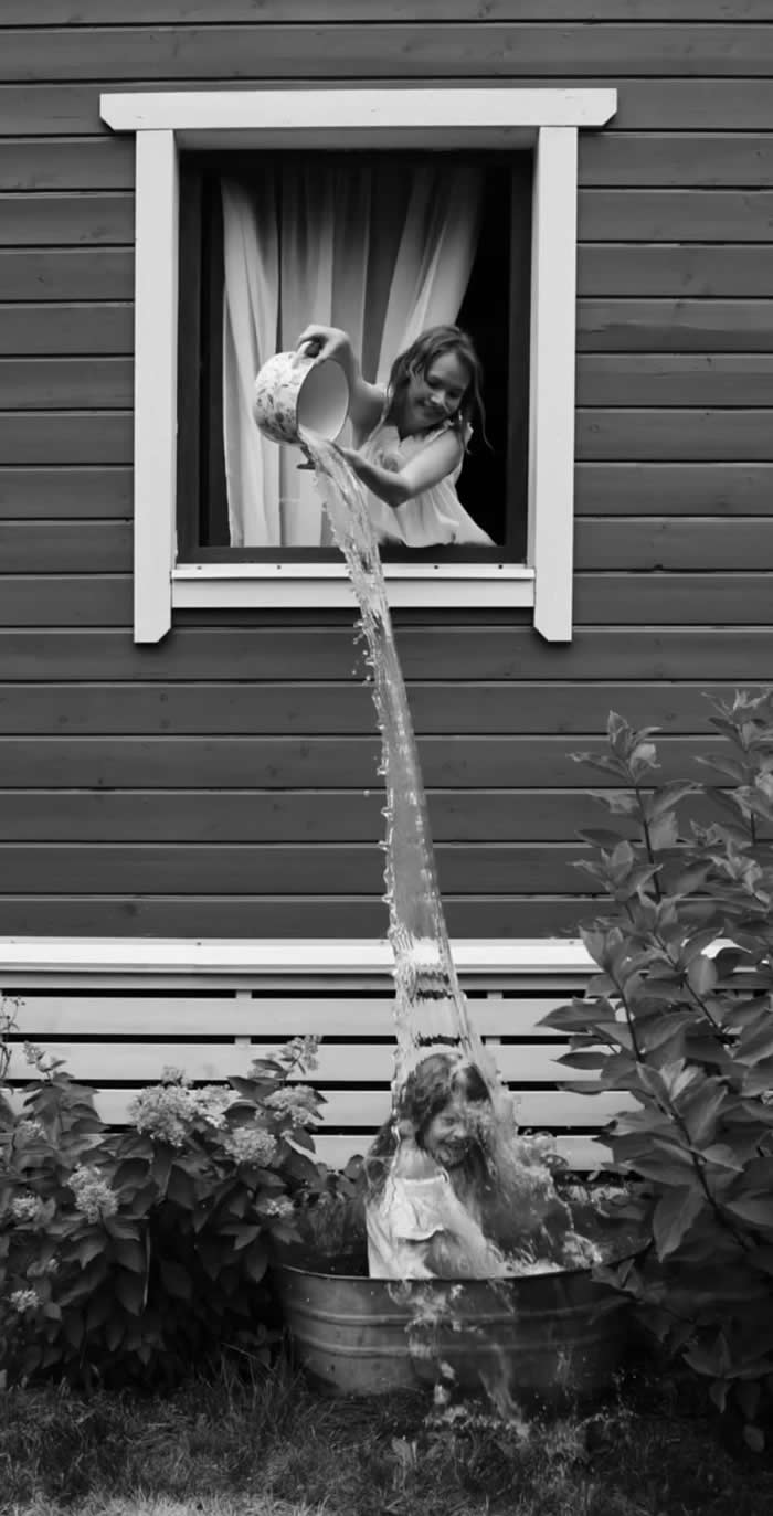 Kid taking a bath and enjoying it - Pure Joy of Childhood Black and White Photos
