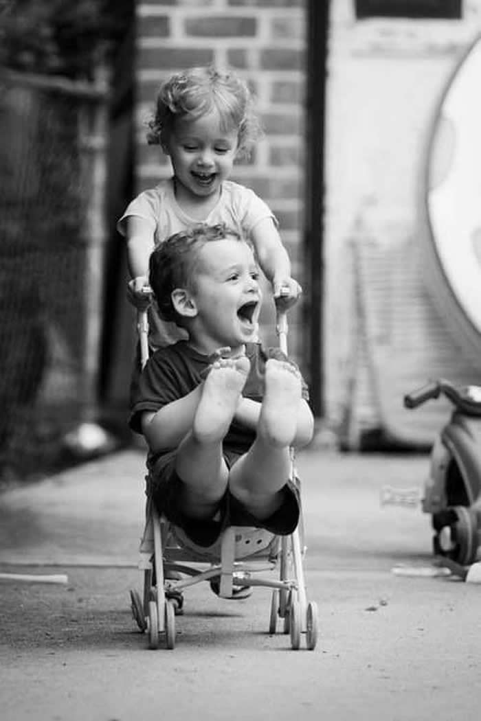 Kids laughing and enjoying the moment - Pure Joy of Childhood Black and White Photos