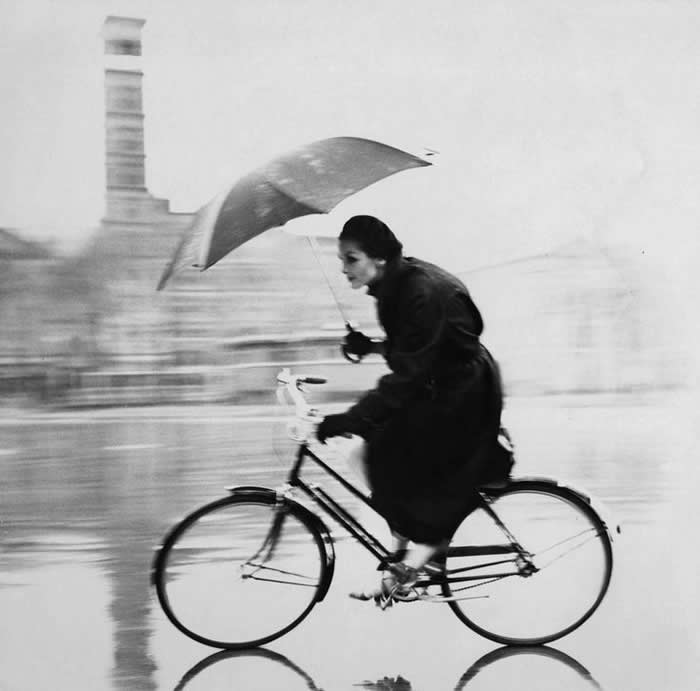 Palumbo's second wife Anne St Marie on a bicycle, ca. 1956 - Iconic Black and White Photos from Greatest Photographers