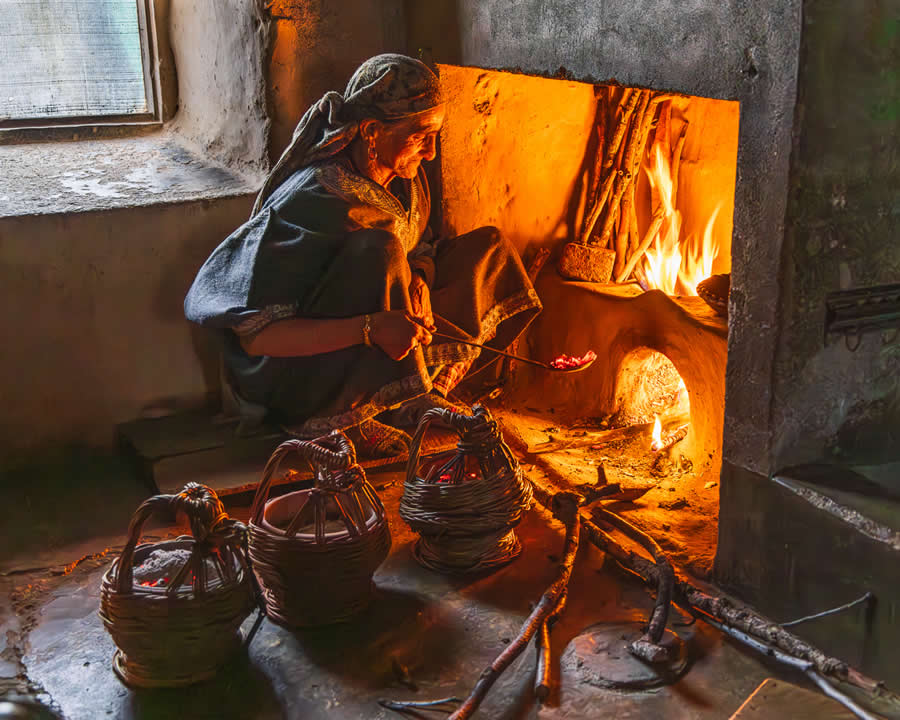 Woman Preparing Kashmiri Kangri Hot Coal Baskets by Emily M. Wilson, United States - Chromatic Photography Awards People and Culture Winners