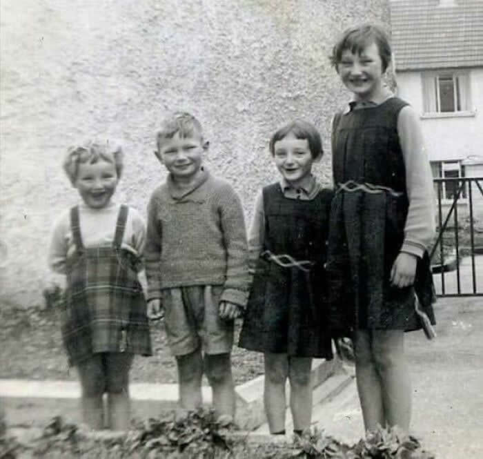 A Young Liam Neeson Pictured With His Sisters, Elizabeth, Bernadette And Rosaleen In 1960 Outside Their Family Home In Ballymena, Co. Antrim, Northern Ireland - Rare Historical Photos Stories Behind the Past