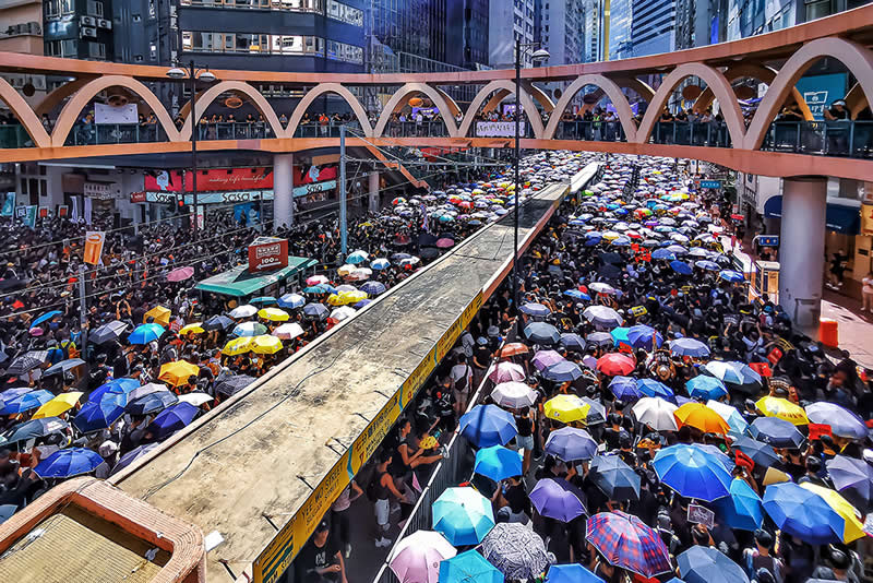 People Marching & Petitioning with Umbrellas by Howard Tong, Honorable Mention in Mobile Photography Awards in People Category