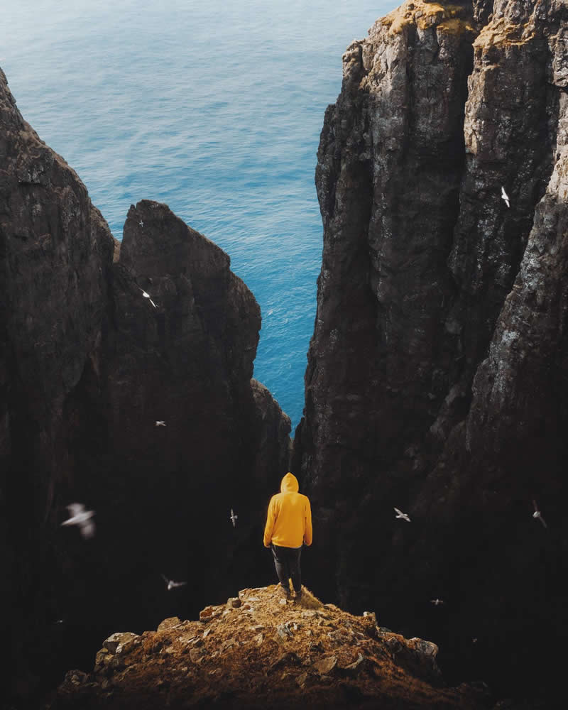 Gazing into the abyss of the chiselled sea cliffs of Su&eth;uroy&lsquo;s west coast - Outdoor Adventure Landscape Photography by Chris