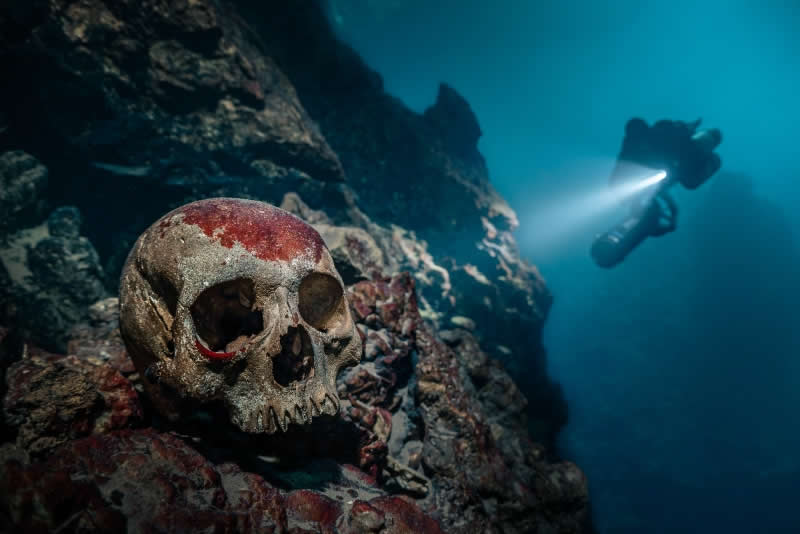 Unrestricted - Silver: Skull at Green Cave Sink by Fan Ping, China, Location: Meizhou, Guangdong, China - 2025 DPG Masters Underwater Imaging Competition Winners