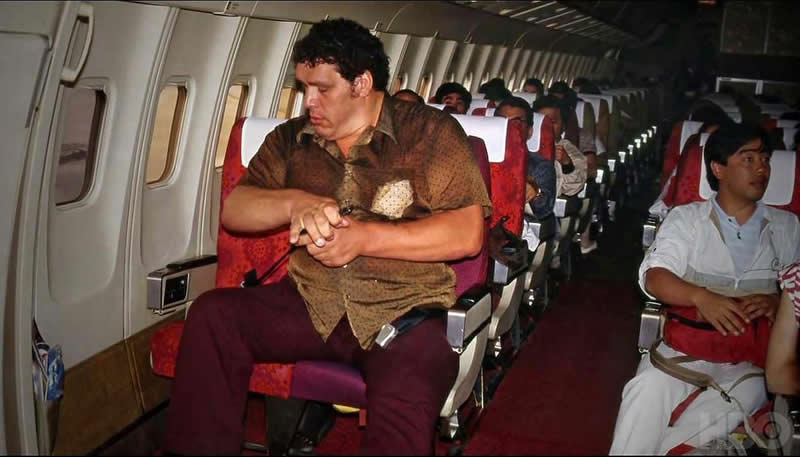 André the Giant riding in a plane in the 1980s. - Rare Historical Photos In Color