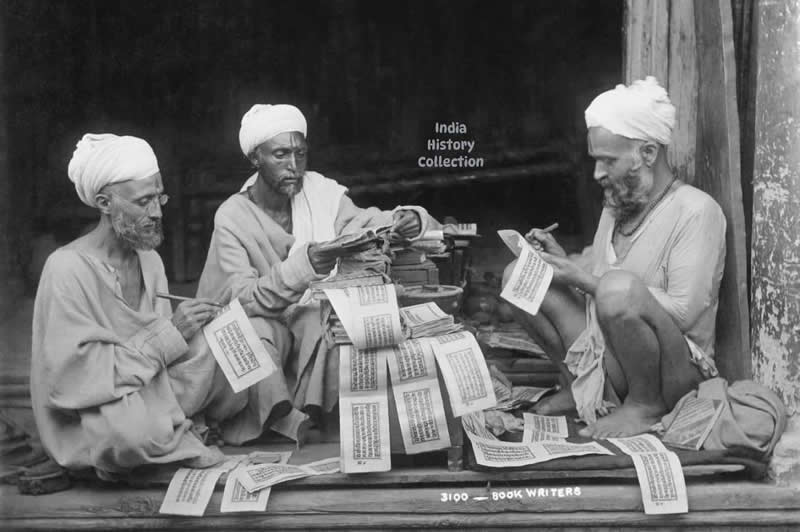 Indian writers gather around a pile of books and papers, 1921 — a quiet moment of intellectual exchange, debate, and literary awakening during the early decades of modern India - Rare Historical Vintage Indian Photos