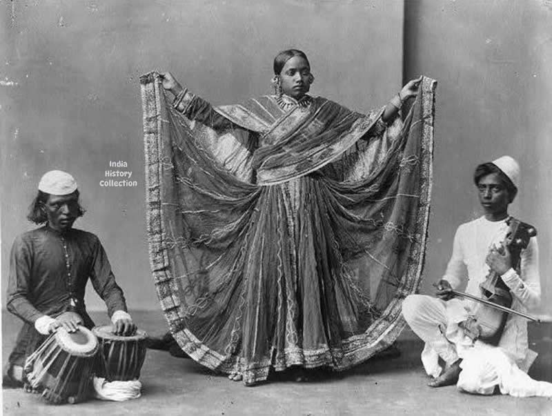 A dancing girl performing with accompanying musicians playing the tabla and sarangi, India — early 1900s - Rare Historical Vintage Indian Photos