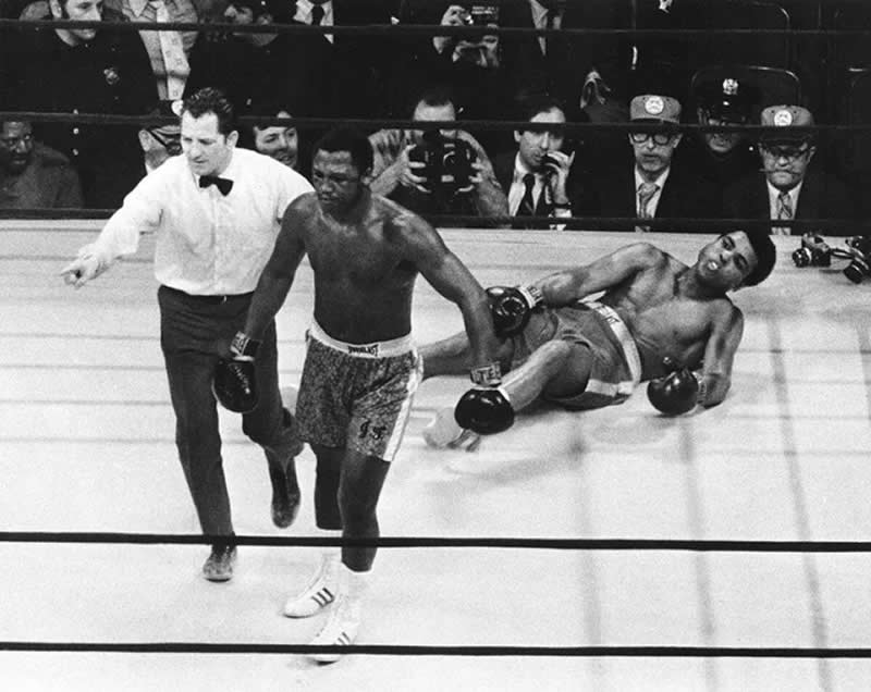 Joe Frazier walked back to his corner after knocking down Muhammad Ali in the 11th round of their first fight also know as fight of the century in 8 March 1971. =- Rare Historical Photos That Bring Forgotten Moments