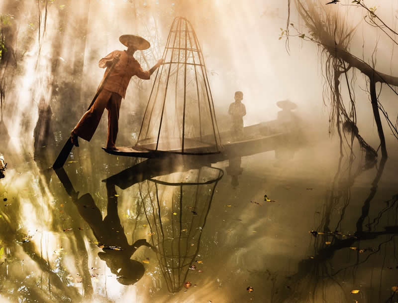 A fisherman and his family begin the day together, drifting through the mangrove forest at dawn - Travel and Cuture Photography by Erdem Kilic