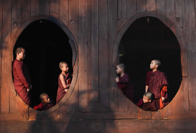 Window to window purity - Young monks at Shwe Yan Pyay Monastery - Travel and Cuture Photography by Erdem Kilic